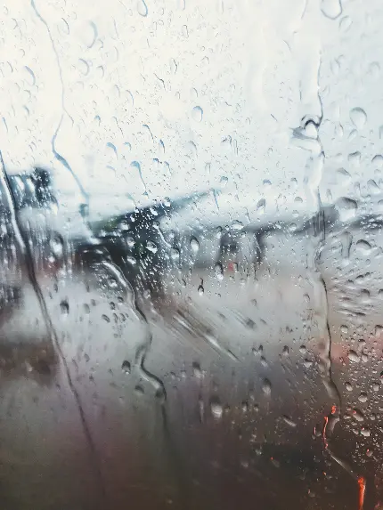 تصویر سفر با هواپیما در باران با کیفیت بالا