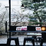 خرید تابلو صندلی کنار پنجره و مجله برای استراحت