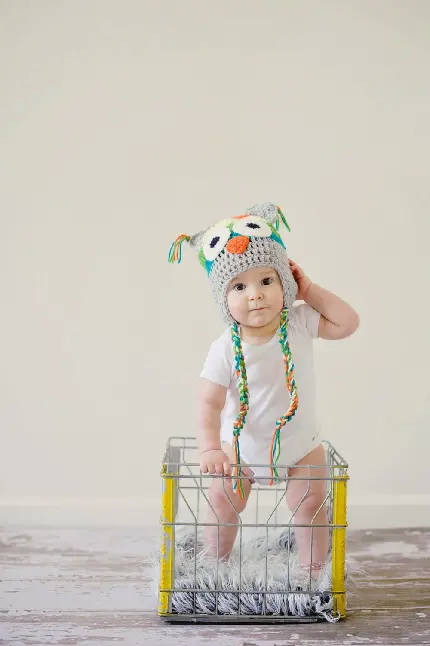 تصویر لباس کودک خوشگل و با نمک با یک کلاه بافت با کیفیت عالی