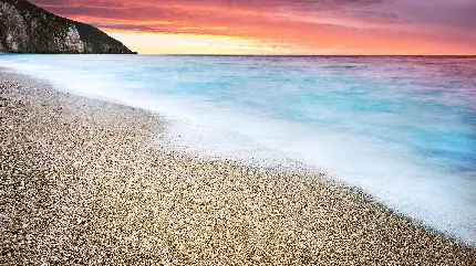 عکس پس زمینه غروب خورشید در ساحل زیبا برای متن و والپیپر گوشی