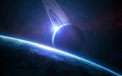 عکس زمینه رویایی سیاره زحل با تم درخشان آبی در فضا