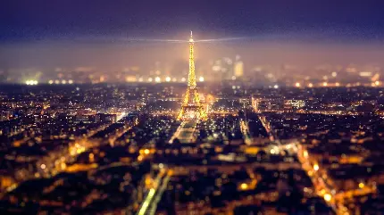 دانلود تصویر مات و از نمای دور برج ایفل در شهر پاریس مهد فرهنگ در شب