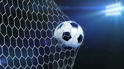 عکس توپ فوتبال در حال پاره کردن تور برای تصویر زمینه