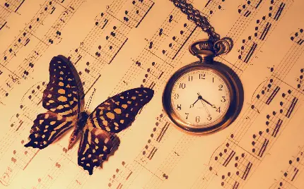 عکس هنری 4K با طرح ساعت قدیمی و پروانه و نت موسیقی برای پروفایل