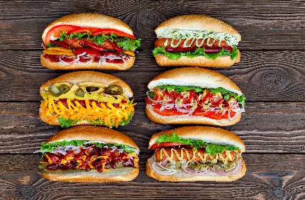 دانلود تصویر زمینه ساندویچ های فست فود لذیذ و رنگارنگ