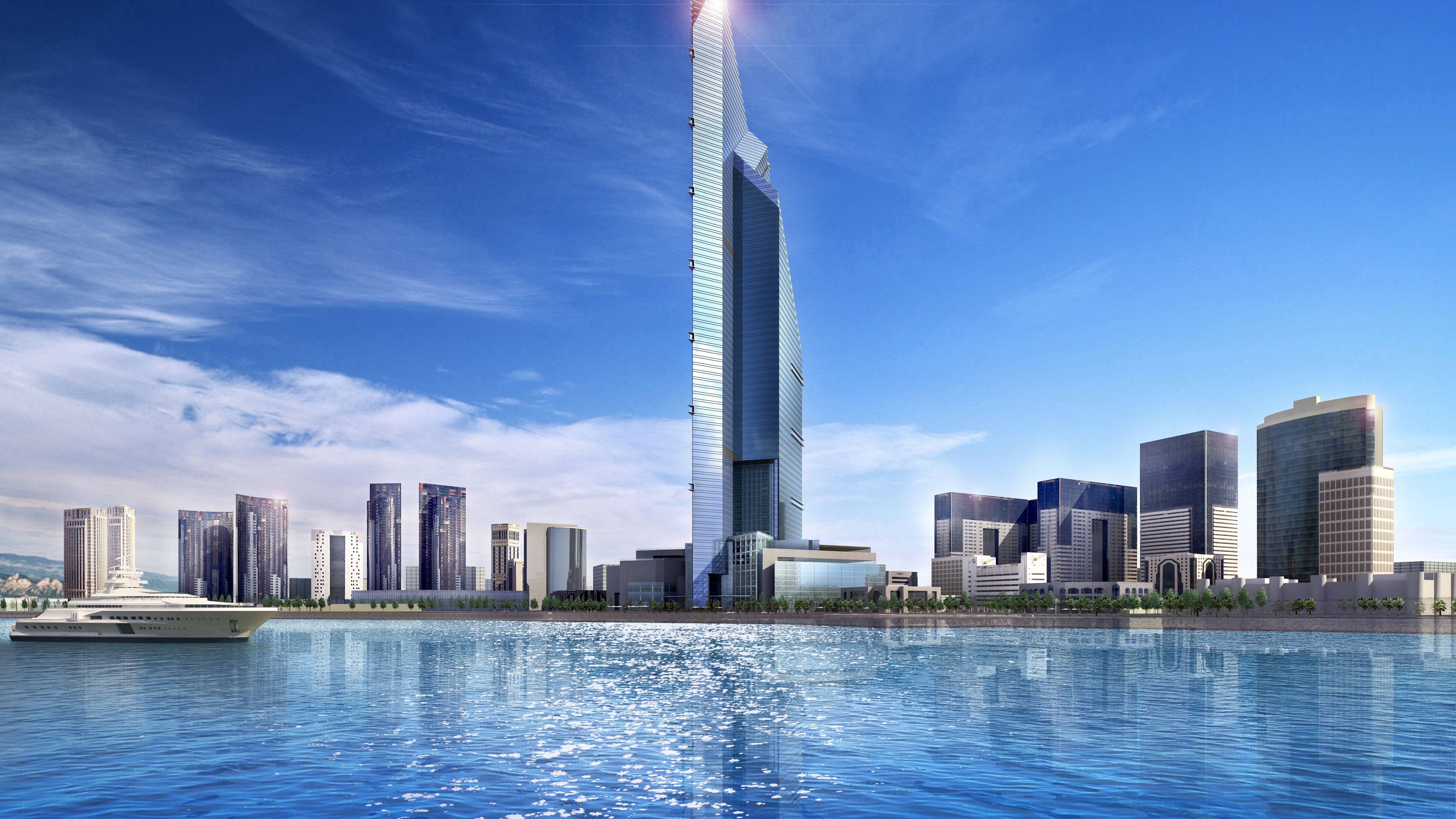 عکس استوک برج بلند زیبا و دریاچه آرامش بخش در دبی