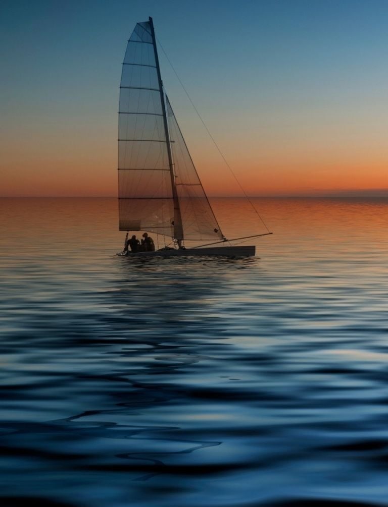 عکس زمینه چشم نواز قایق بادبانی در غروب دریا مخصوص گوشی