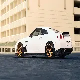 چاپ قاب موبایل و گوشی تصویر نیسان جی تی آر Nissan GT-R سفید رنگ با رینگ های طلایی