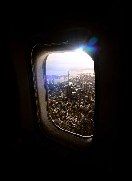 عکس باشکوه شهرها و مناظر شهری از پشت پنجره شیشه ای هواپیما