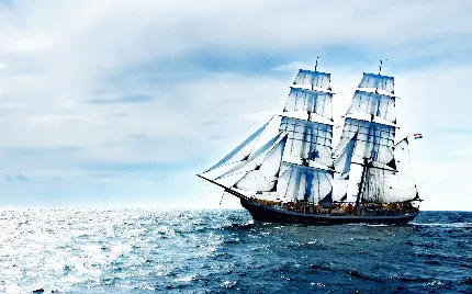 زمینه لاکچری لپتاپ با طرح کشتی هلندی جذاب با بادبان های کشیده