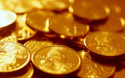 دانلود تصویر قشنگ سکه های طلا بر روی هم برای گوشی 