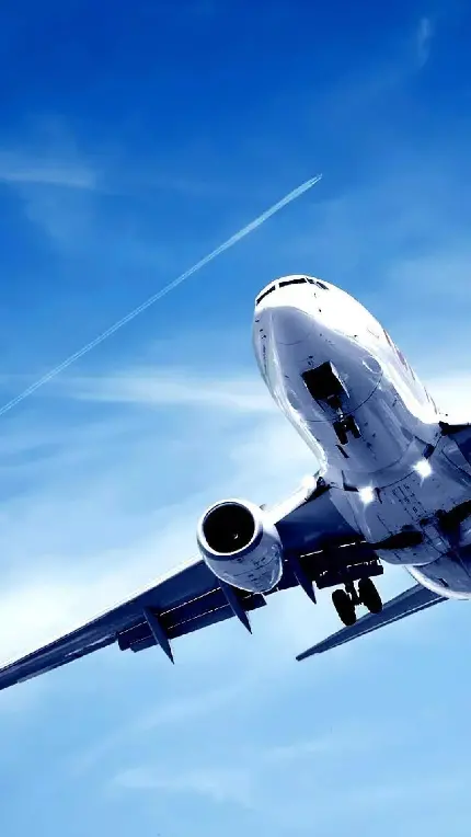 دانلود عکس زمینه هواپیما مسافربری در آسمان آبی و صاف