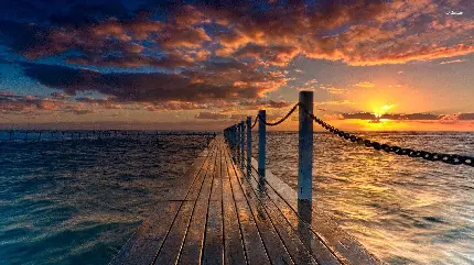 دانلود تصویر باشکوه اسکله چوبی دریا هنگام غروب خورشید