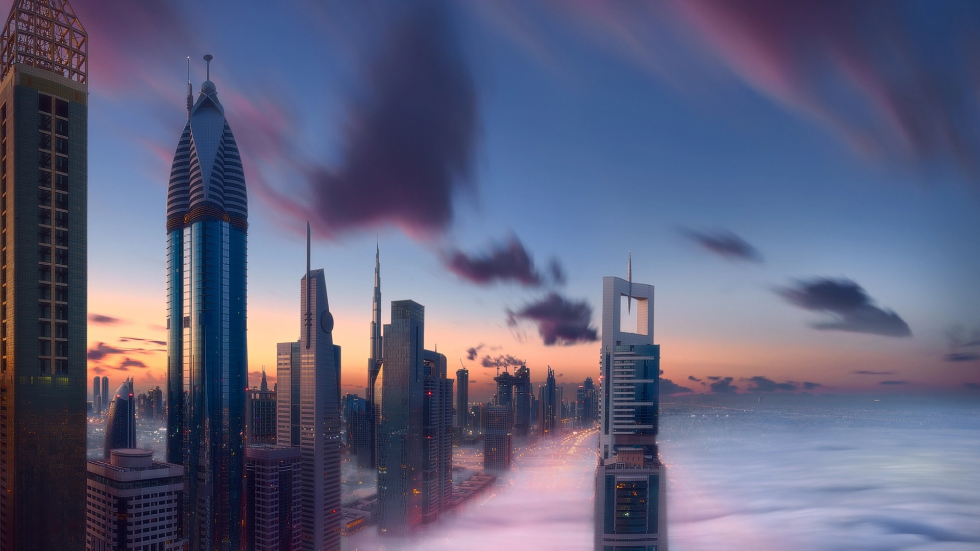 عکس پس زمینه از دبی و برج های آسمان خراش بر اوج ابر ها