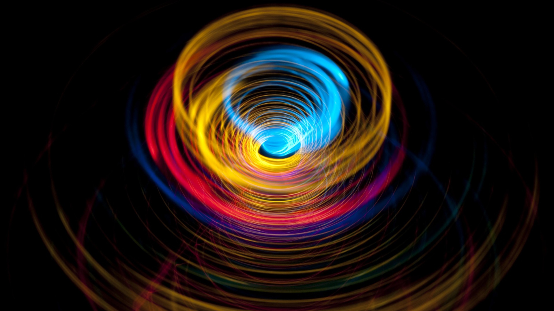 تصویر بک گراند آبسترکت به رنگ سیاه و طرح دایره ای رنگارنگی 