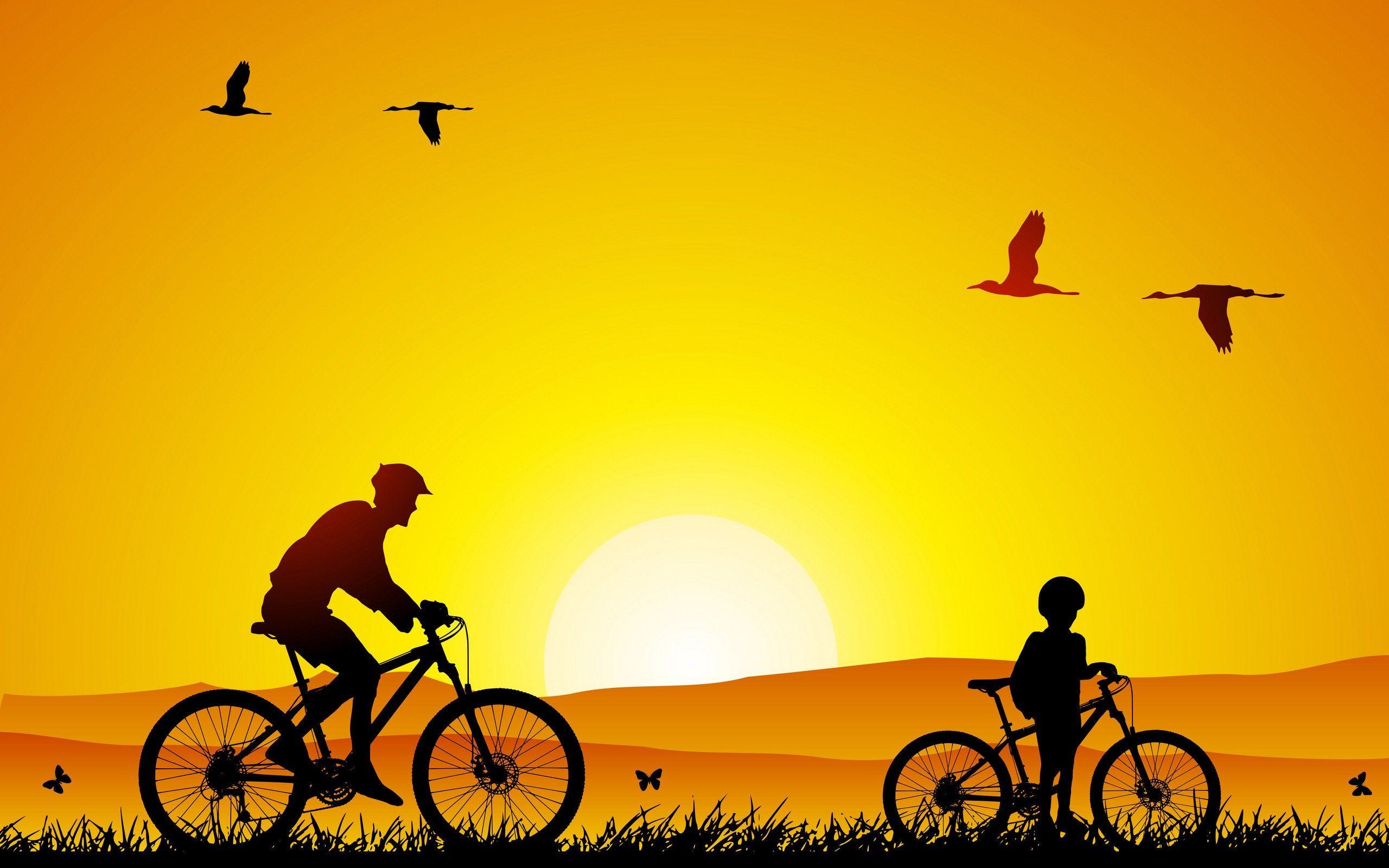 دانلود تصویر پر حس پدر و پسر هنگام دوچرخه سواری 
