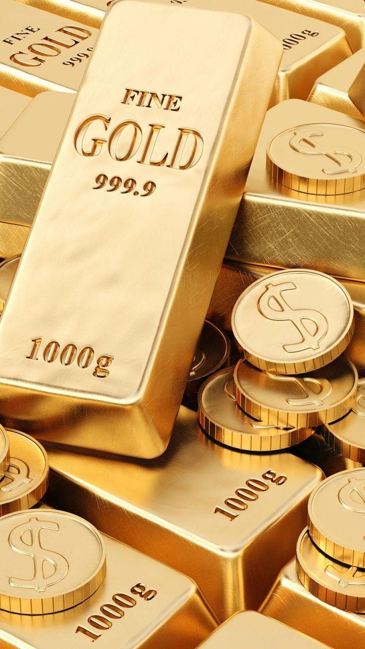 تصویر استوک شمش طلا در کنار سکه های طلا gold 