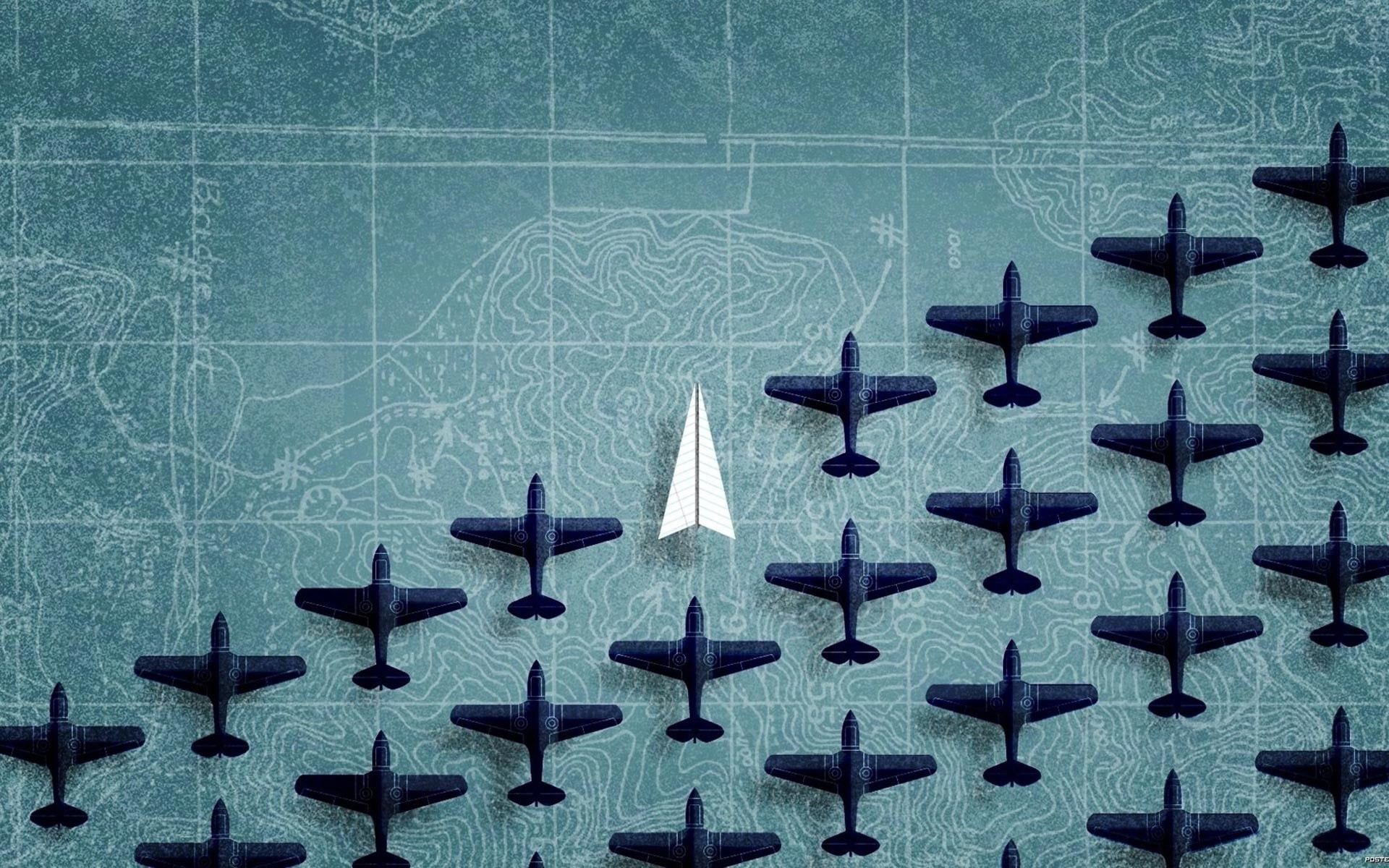 تصویر جالب توجه هواپیمای کاغذی سفید بین هواپیماهای جنگی