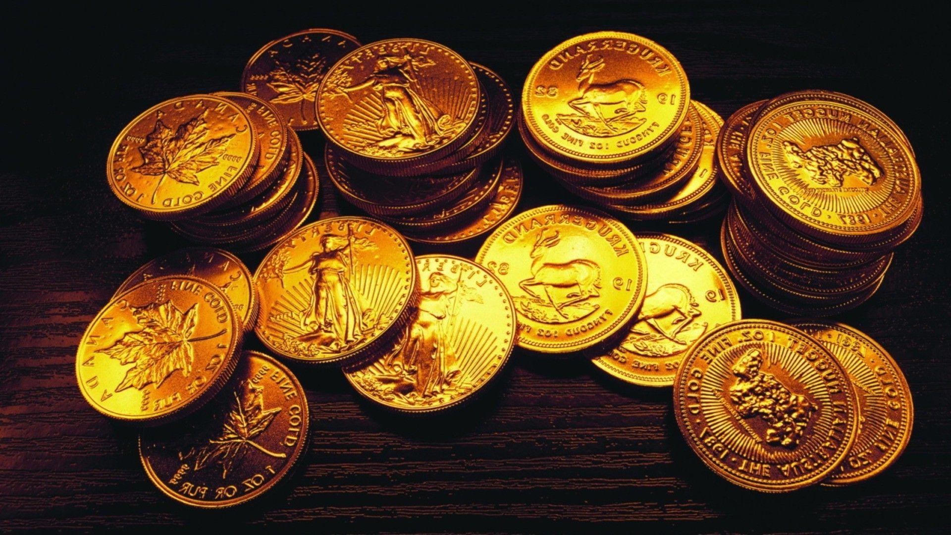 دانلود رایگان عکس زمینه جذاب از سکه های طلای چیده شده
