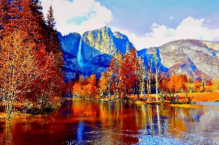 رویایی ترین تصویر زمینه دریاچه کنار کوهی به همراه درختان پاییزی 