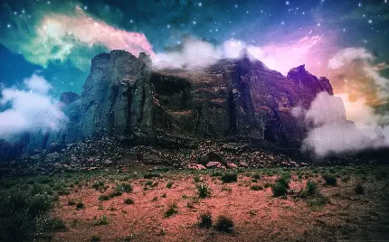 عکس تصویر زمینه از صخره های روی کوه و آسمان پر ستاره 