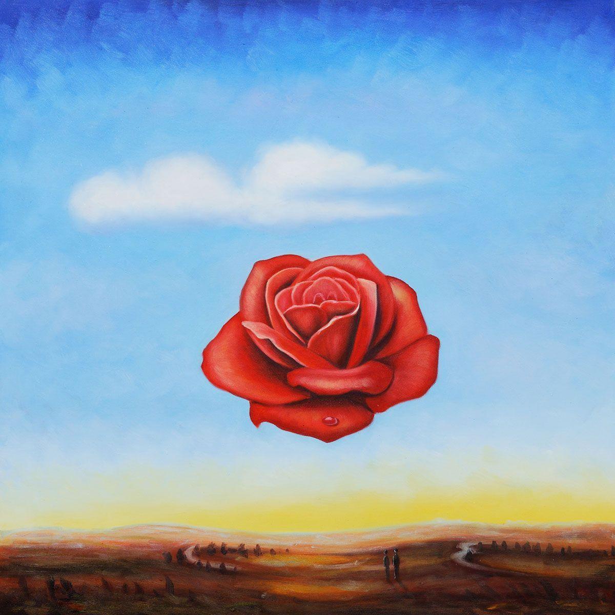 عکس نقاشی سورئال گل رز قرمز معلق در منطقه ای بیابانی