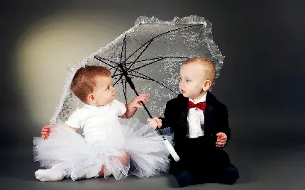 عکس‌های گرفته شده در آتلیه از دختر و پسر بچه به صورت عروس و داماد