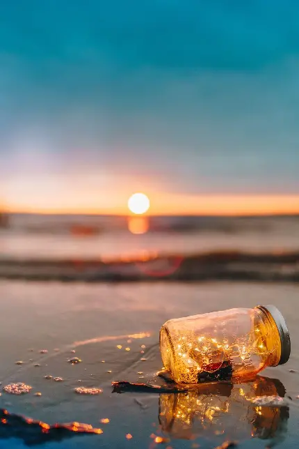 عکاسی از طلوع خورشید در ساحل شنی